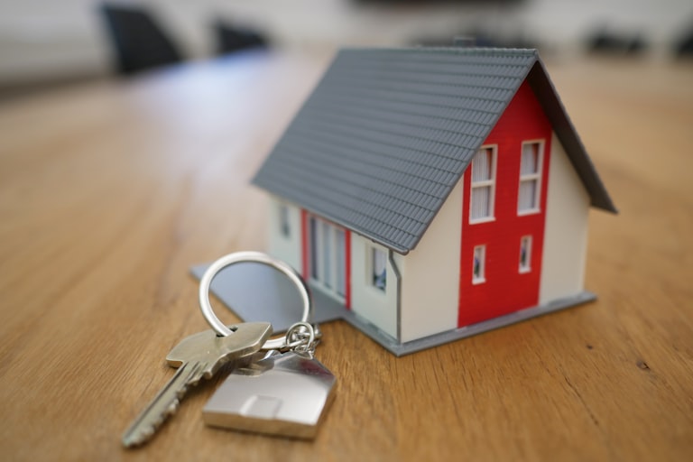 House keys beside a model home