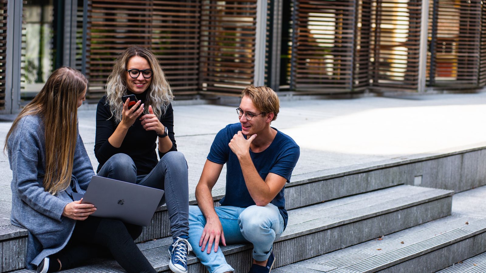 Professionals collaborating outdoors